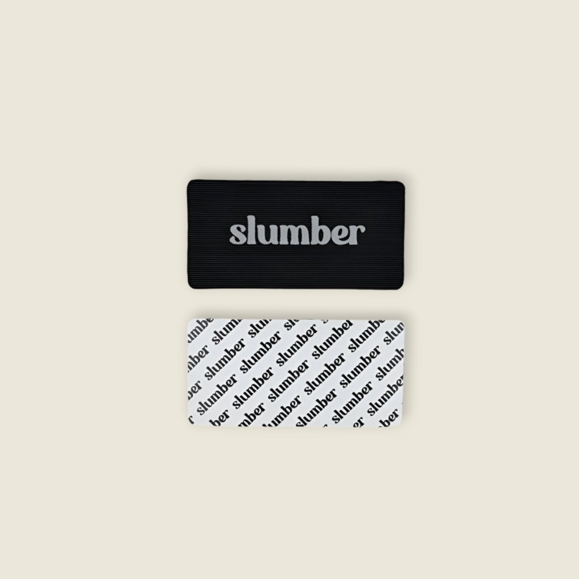 Close-up of Slumber mouth tape in black and white designs, showcasing branding and material details.